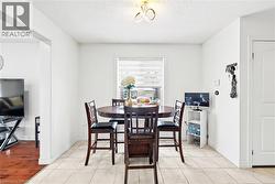 Dining area featuring a textured ceiling - 