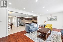 Living room featuring light wood-style flooring and recessed lighting - 