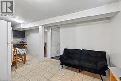 Living area with light tile patterned floors - 