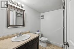 Bathroom featuring vanity and light tile patterned floors - 