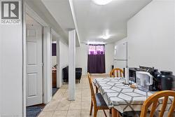 Dining area featuring light tile patterned flooring - 