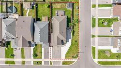 Aerial perspective of suburban area featuring property boundaries highlighted - 