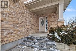 Doorway to property with brick siding - 