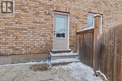 Entrance to property with brick siding - 