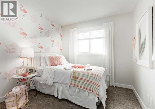 PLEASE NOTE: Photos are of a Showhome of the same model – fit & finish may differ. Interior selections & floorplans shown in photos - 162 Lanark Gate Se, Airdrie, AB - Indoor Photo Showing Bedroom