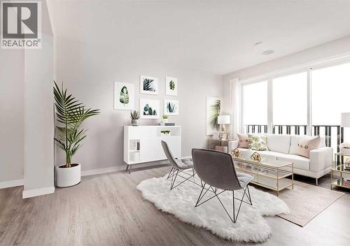 PLEASE NOTE: Photos are of a Showhome of the same model – fit & finish may differ. Interior selections & floorplans shown in photos - 162 Lanark Gate Se, Airdrie, AB - Indoor Photo Showing Living Room