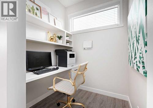 PLEASE NOTE: Photos are of a Showhome of the same model – fit & finish may differ. Interior selections & floorplans shown in photos - 162 Lanark Gate Se, Airdrie, AB - Indoor Photo Showing Office
