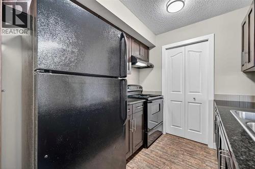 207, 355 Taralake Way Ne, Calgary, AB - Indoor Photo Showing Kitchen With Double Sink