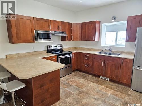 251 5Th Avenue Se, Swift Current, SK - Indoor Photo Showing Kitchen With Stainless Steel Kitchen With Double Sink