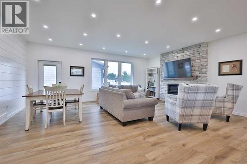 246 4A Street, Stirling, AB - Indoor Photo Showing Living Room With Fireplace