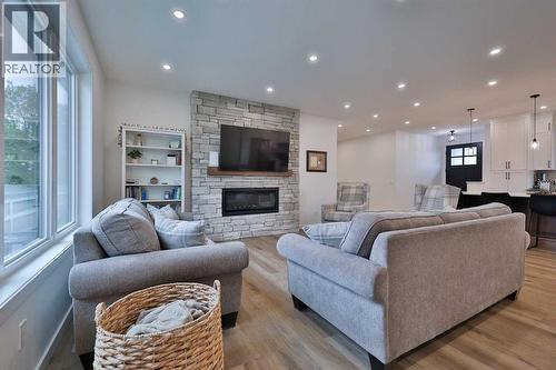 246 4A Street, Stirling, AB - Indoor Photo Showing Living Room With Fireplace