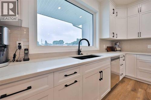 246 4A Street, Stirling, AB - Indoor Photo Showing Kitchen With Double Sink
