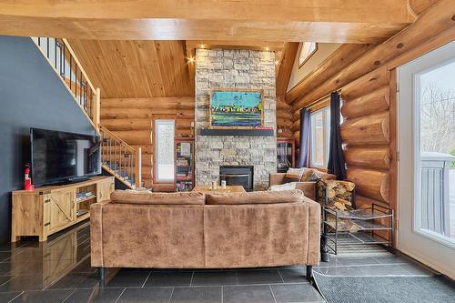 Salon - 472 Ch. Champigny, Larouche, QC - Indoor With Fireplace
