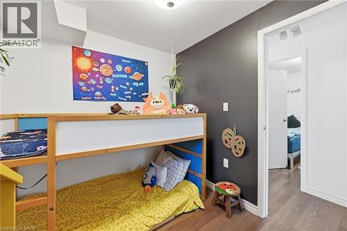 Bedroom featuring wood finished floors and baseboards - 18 Fraser Avenue, Hamilton, ON - Indoor