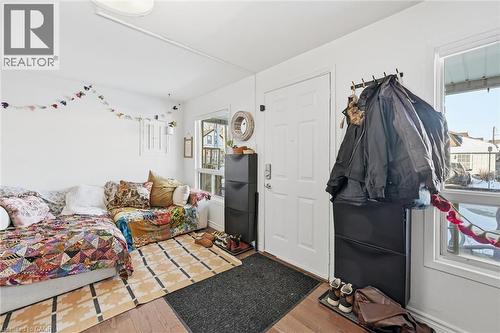 Living room with wood finished floors and baseboards - 18 Fraser Avenue, Hamilton, ON - Indoor