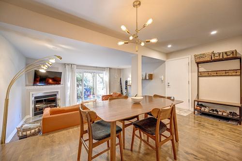 Salle à manger - A-179 Av. De Navarre, Saint-Lambert, QC - Indoor Photo Showing Dining Room With Fireplace