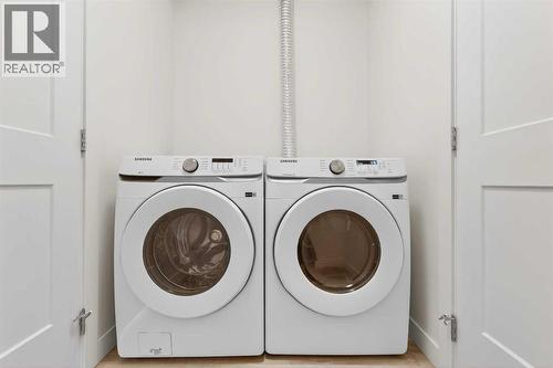 411, 40 Sage Hill Walk Nw, Calgary, AB - Indoor Photo Showing Laundry Room