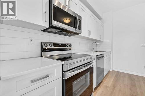 411, 40 Sage Hill Walk Nw, Calgary, AB - Indoor Photo Showing Kitchen