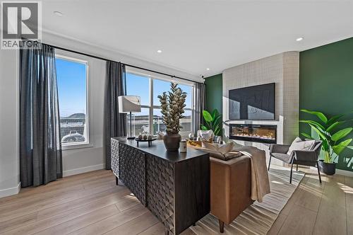 61 Keystone Creek Terrace, Calgary, AB - Indoor Photo Showing Living Room With Fireplace
