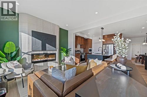 61 Keystone Creek Terrace, Calgary, AB - Indoor Photo Showing Living Room With Fireplace