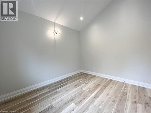 Spare room with vaulted ceiling and light wood-type flooring - 110 Deschene Avenue, Hamilton, ON - Indoor Photo Showing Other Room