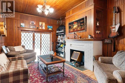 10507 Bradbury Drive Sw, Calgary, AB - Indoor Photo Showing Living Room With Fireplace