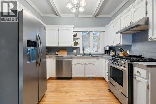 10507 Bradbury Drive Sw, Calgary, AB - Indoor Photo Showing Kitchen With Stainless Steel Kitchen With Double Sink