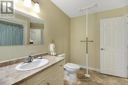 Single vanity, tub, shower, toilet. - 
