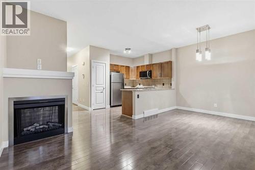 71 Panatella Hill Nw, Calgary, AB - Indoor With Fireplace