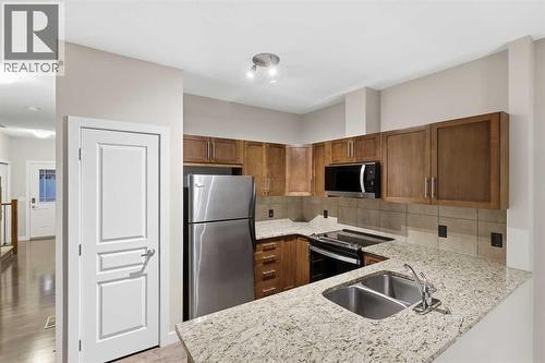 71 Panatella Hill Nw, Calgary, AB - Indoor Photo Showing Kitchen With Double Sink