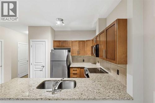 71 Panatella Hill Nw, Calgary, AB - Indoor Photo Showing Kitchen With Double Sink