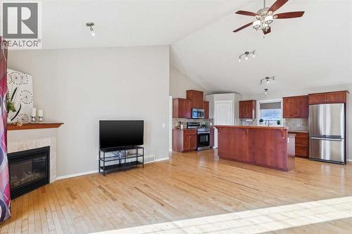 100B Westview Drive, Nanton, AB - Indoor With Fireplace