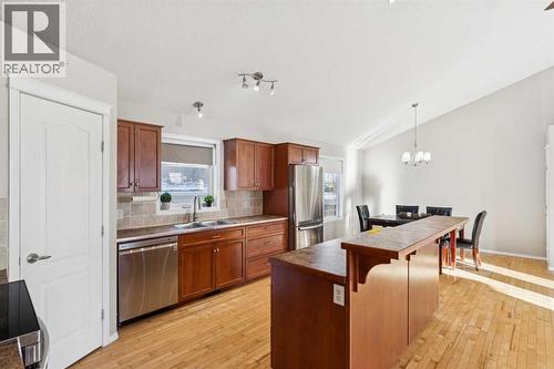 100B Westview Drive, Nanton, AB - Indoor Photo Showing Kitchen With Stainless Steel Kitchen With Double Sink