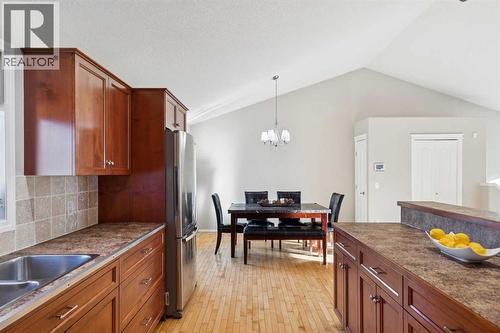 100B Westview Drive, Nanton, AB - Indoor Photo Showing Kitchen With Double Sink