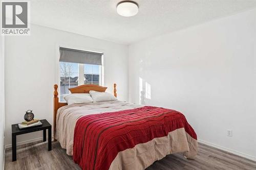 Second bedroom - main level - 100B Westview Drive, Nanton, AB - Indoor Photo Showing Bedroom