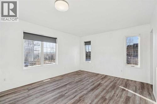 Primary Suite - Main Floor - 100B Westview Drive, Nanton, AB - Indoor Photo Showing Other Room