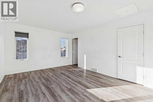 Primary Suite - Main Floor - 100B Westview Drive, Nanton, AB - Indoor Photo Showing Other Room