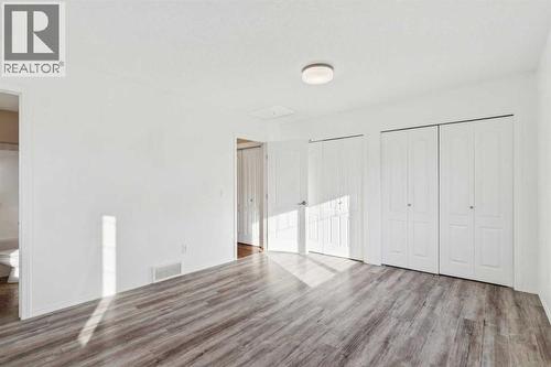 Primary Suite - Main Floor - 100B Westview Drive, Nanton, AB - Indoor Photo Showing Other Room