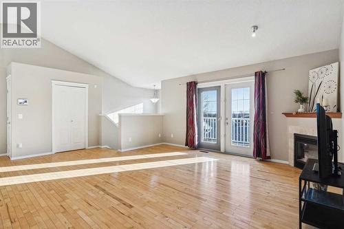 100B Westview Drive, Nanton, AB - Indoor With Fireplace