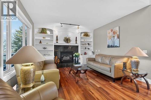 14 Christie Estate Terrace Sw, Calgary, AB - Indoor Photo Showing Living Room With Fireplace