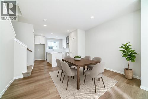 VIRTUALLY STAGED - PLEASE NOTE: Photos are of a DIFFERENT Spec Home of the same model – fit and finish may differ. Interior selections and floorplans shown in photos - 158 Bartlett Crescent Se, Calgary, AB - Indoor Photo Showing Dining Room