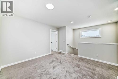 PLEASE NOTE: Photos are of a DIFFERENT Spec Home of the same model – fit and finish may differ. Interior selections and floorplans shown in photos - 158 Bartlett Crescent Se, Calgary, AB - Indoor Photo Showing Other Room