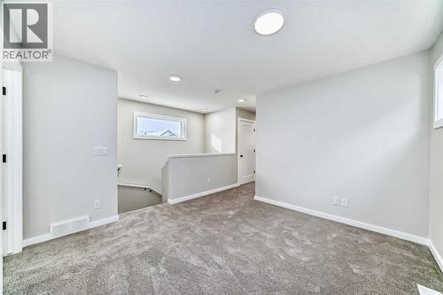 PLEASE NOTE: Photos are of a DIFFERENT Spec Home of the same model – fit and finish may differ. Interior selections and floorplans shown in photos - 158 Bartlett Crescent Se, Calgary, AB - Indoor Photo Showing Other Room