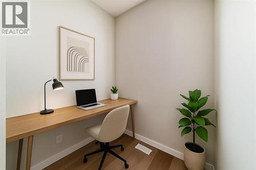 VIRTUALLY STAGED - PLEASE NOTE: Photos are of a DIFFERENT Spec Home of the same model – fit and finish may differ. Interior selections and floorplans shown in photos - 158 Bartlett Crescent Se, Calgary, AB - Indoor Photo Showing Office