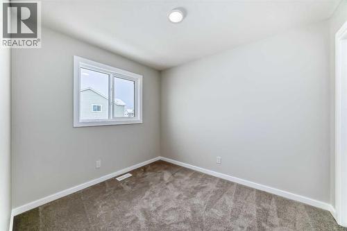 PLEASE NOTE: Photos are of a DIFFERENT Spec Home of the same model – fit and finish may differ. Interior selections and floorplans shown in photos - 158 Bartlett Crescent Se, Calgary, AB - Indoor Photo Showing Other Room