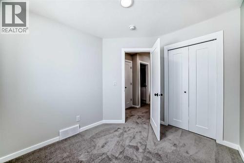 PLEASE NOTE: Photos are of a DIFFERENT Spec Home of the same model – fit and finish may differ. Interior selections and floorplans shown in photos - 158 Bartlett Crescent Se, Calgary, AB - Indoor Photo Showing Other Room