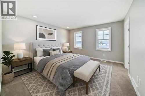 VIRTUALLY STAGED - PLEASE NOTE: Photos are of a DIFFERENT Spec Home of the same model – fit and finish may differ. Interior selections and floorplans shown in photos - 158 Bartlett Crescent Se, Calgary, AB - Indoor Photo Showing Bedroom