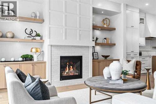 Photo is from a similar past project - 2533 2 Avenue Nw, Calgary, AB - Indoor Photo Showing Living Room With Fireplace