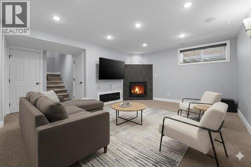 Basement (Virtually Staged) - 83 Kirton Close, Red Deer, AB - Indoor Photo Showing Basement With Fireplace