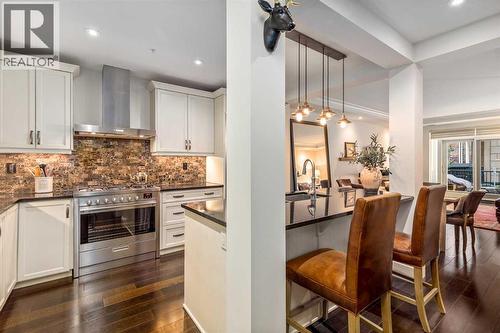 105, 121 Quarry Way Se, Calgary, AB - Indoor Photo Showing Kitchen With Upgraded Kitchen